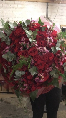100 Red Naomi Rose and wax flower bouquet