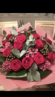 Luxury 12 Red Naomi rose, wax flower, aspidistra bouquet