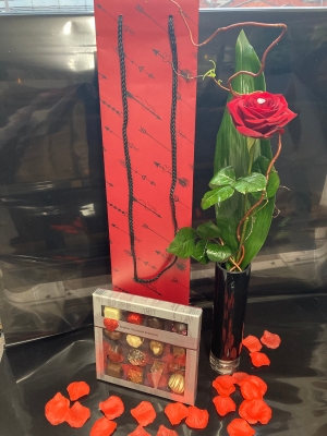 Single Red rose in a elegant vase with Chocolates